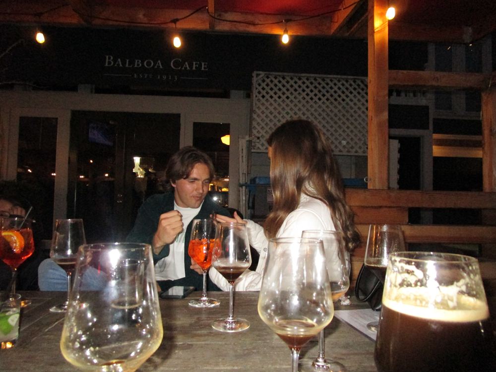Cami and Blake at a patio table at Balboa Cafe
