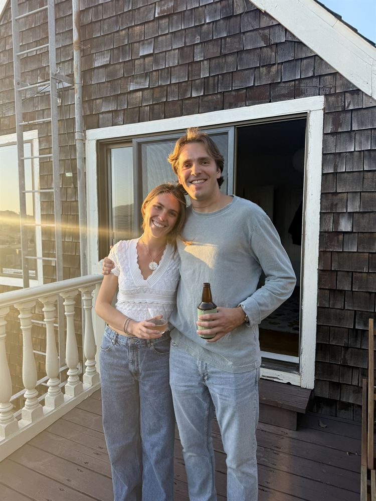 On a shingled deck in evening sun